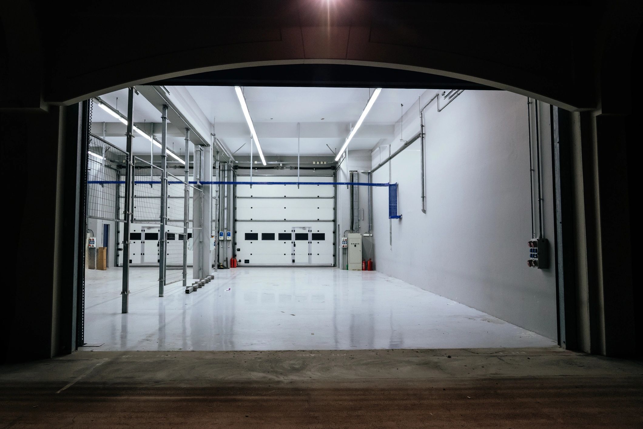 Modern commercial entrance with secure shutter-style opening